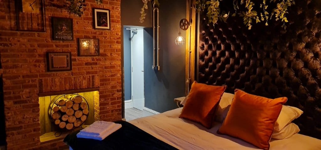 The Bridgewater room with exposed brick fireplace