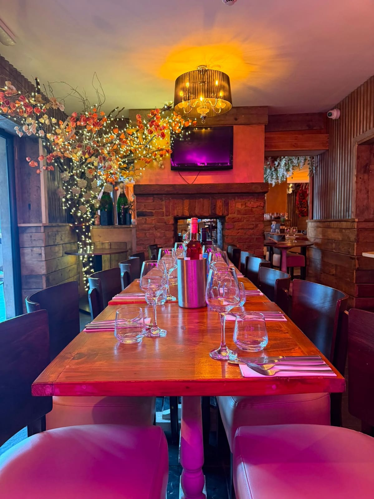 Banquette seating and a long table in the semi-private dining area